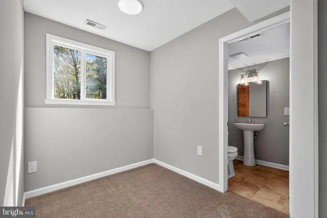 an empty room that has a window