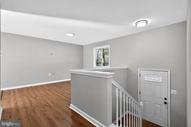 a view of entryway with wooden floor