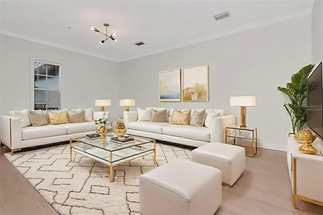 a view of a dining room with furniture and a window