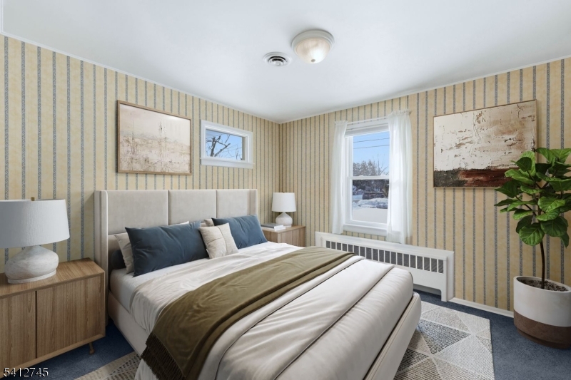 47 Clinton Avenue New Providence, NJ 07974 - Photo 17 of 43 a bedroom with bed and a potted plant