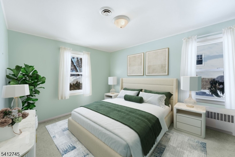 47 Clinton Avenue New Providence, NJ 07974 - Photo 20 of 43 a bedroom with a large bed and a couch