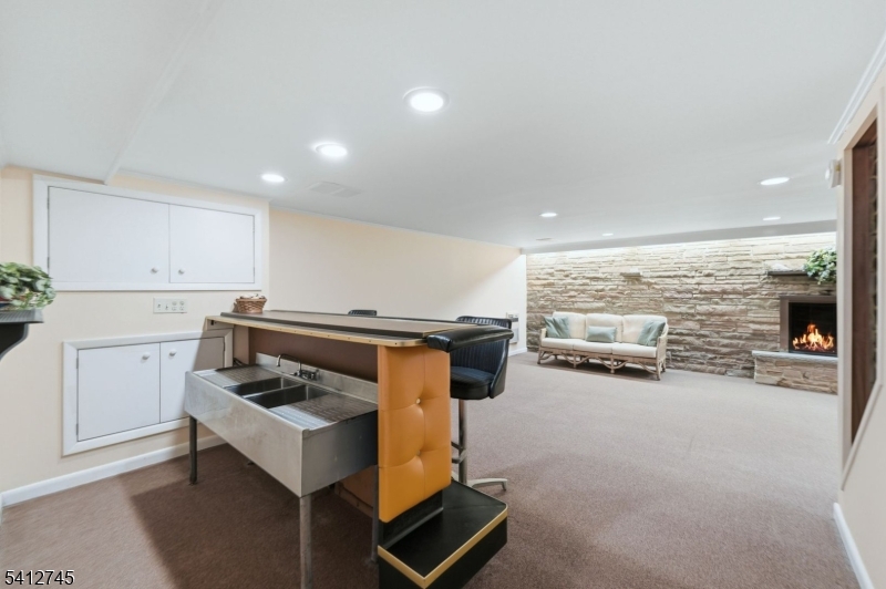 47 Clinton Avenue New Providence, NJ 07974 - Photo 28 of 43 a kitchen with furniture and a stove