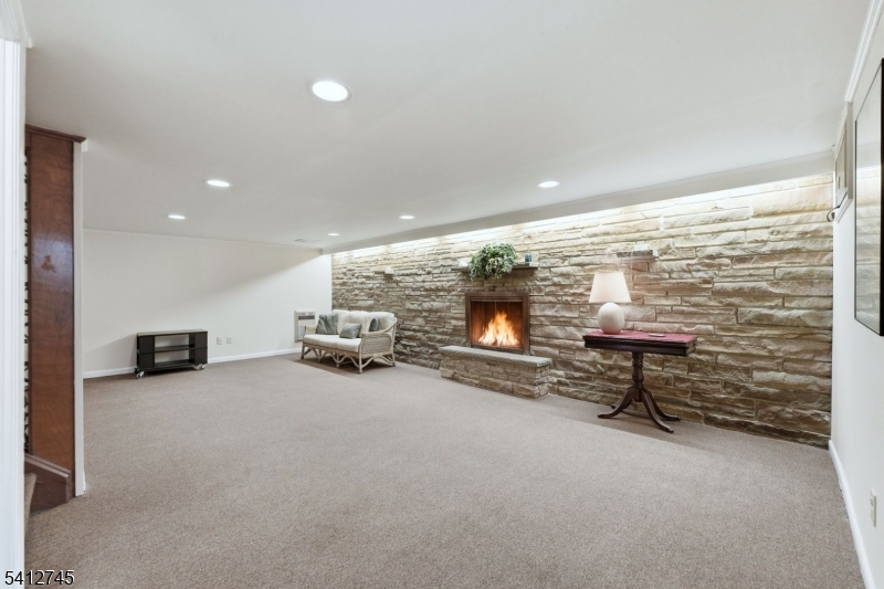 47 Clinton Avenue New Providence, NJ 07974 - Photo 29 of 43 a lobby with furniture and a fireplace