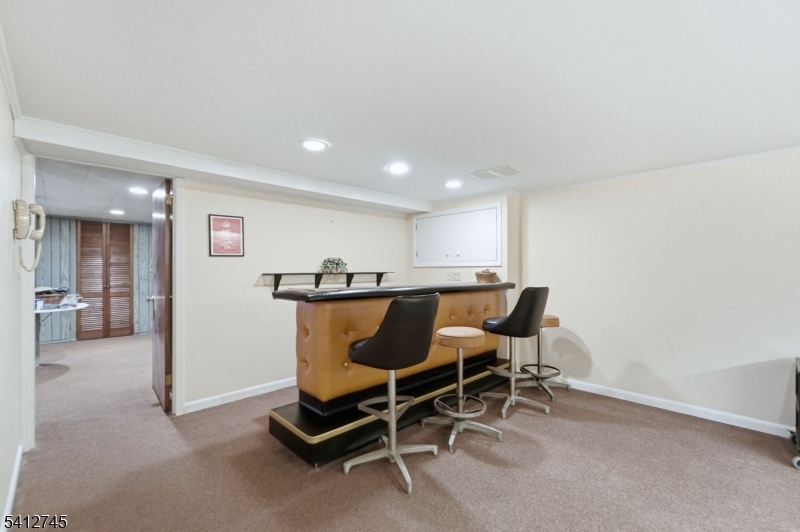 47 Clinton Avenue New Providence, NJ 07974 - Photo 30 of 43 a view of a dining room with furniture