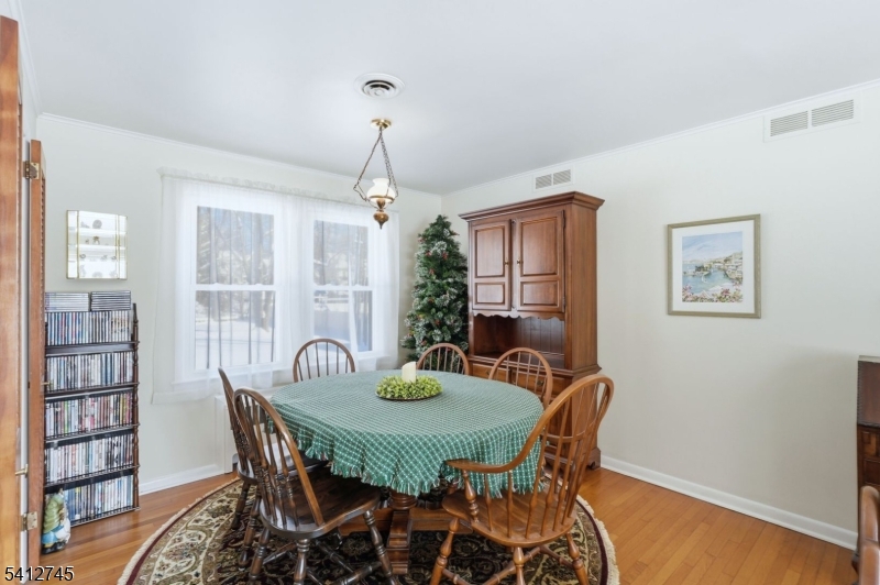 47 Clinton Avenue New Providence, NJ 07974 - Photo 8 of 43 a view of a dining room with furniture window and wooden floor