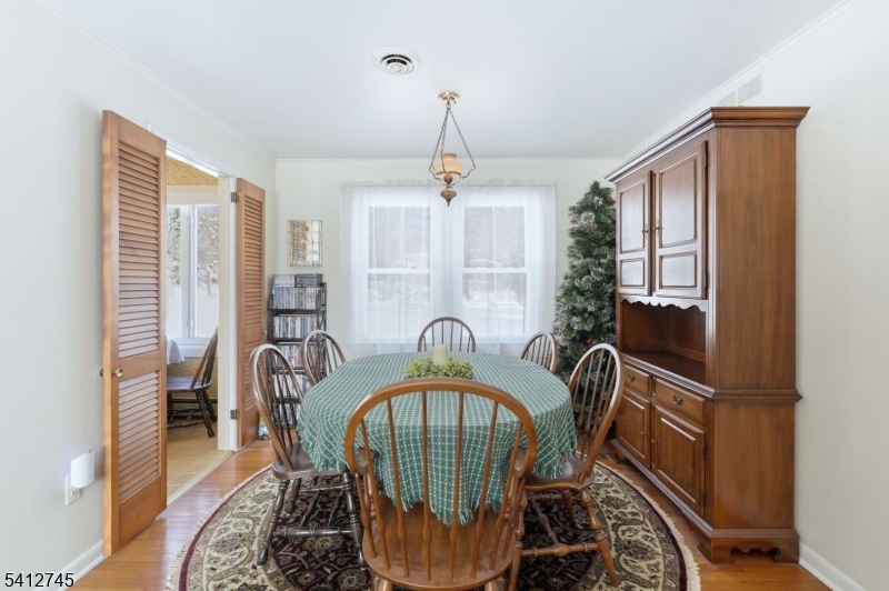 47 Clinton Avenue New Providence, NJ 07974 - Photo 9 of 43 a view of a hallway with furniture