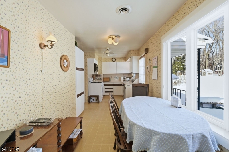 47 Clinton Avenue New Providence, NJ 07974 - Photo 10 of 43 a kitchen with a table and chairs