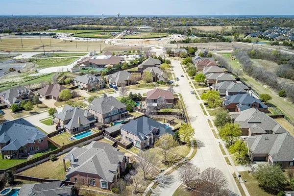 an aerial view of residential houses with outdoor space
