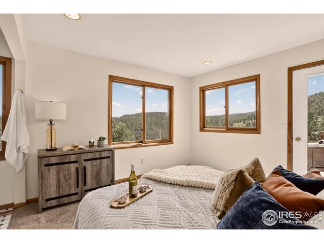 a bedroom with furniture and a window