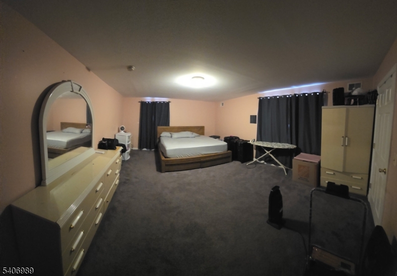 26 Clinton Place Newark, NJ 07108 - Photo 14 of 18 a view of living room with furniture and a flat screen tv