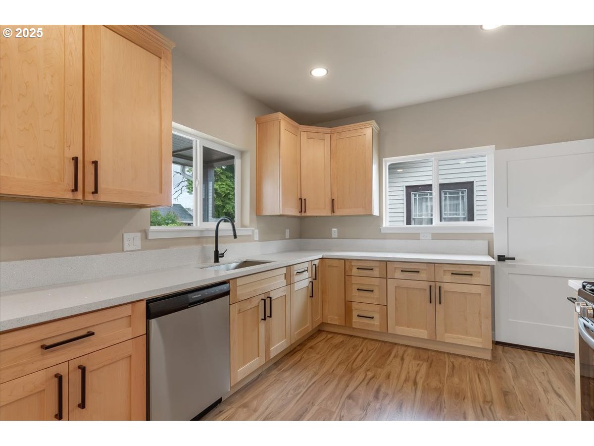 494 17th Street Northeast Salem, OR 97301 - Photo 13 of 44 a kitchen with a sink cabinets and window