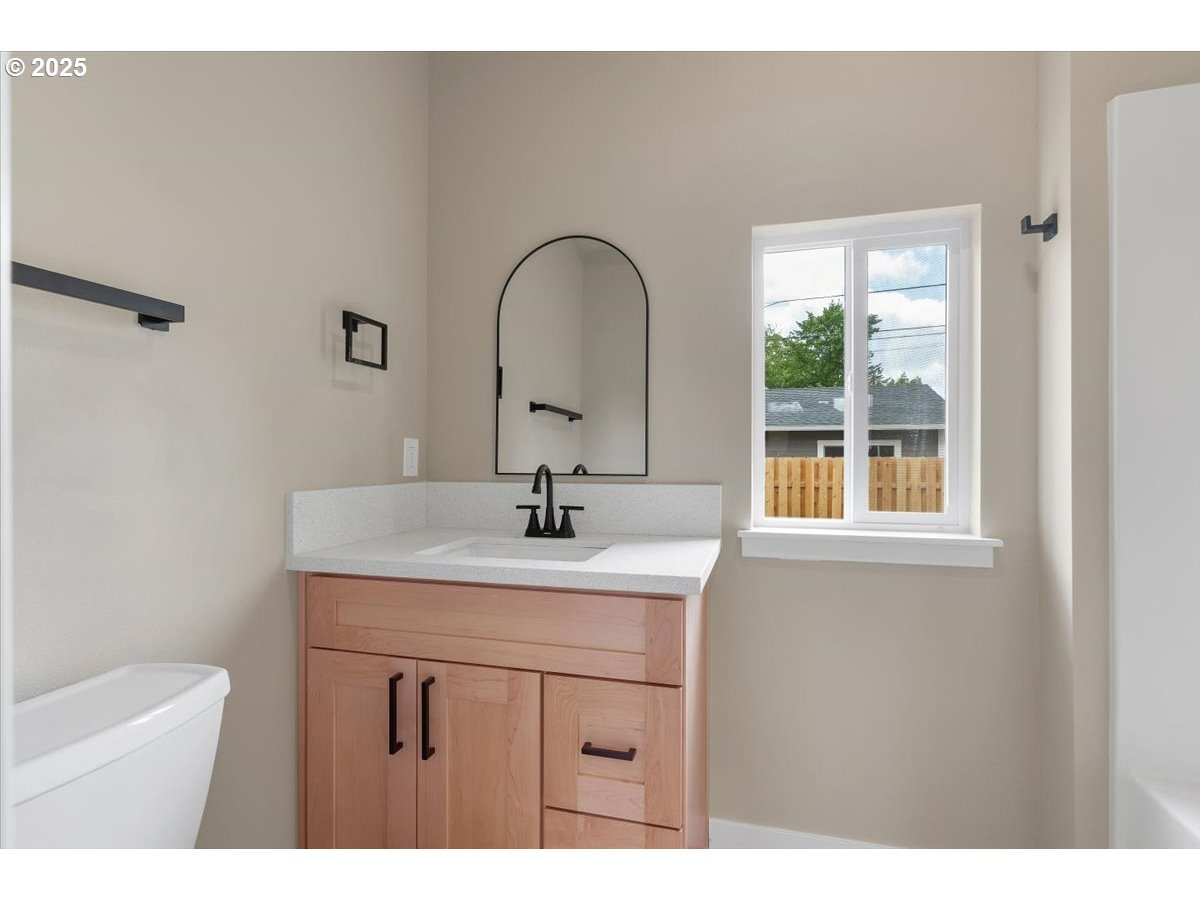 494 17th Street Northeast Salem, OR 97301 - Photo 19 of 44 a bathroom with a sink and a mirror