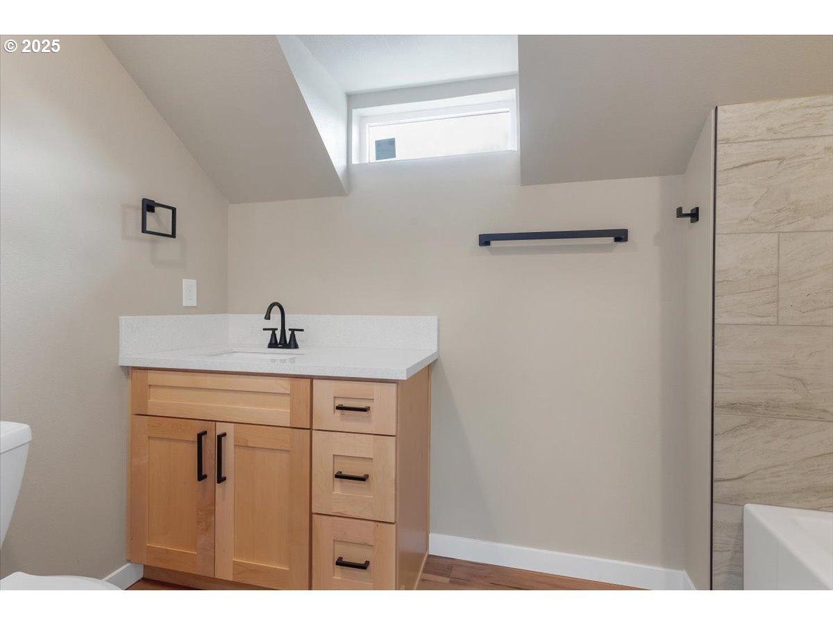 494 17th Street Northeast Salem, OR 97301 - Photo 20 of 44 a bathroom with a sink mirror and vanity