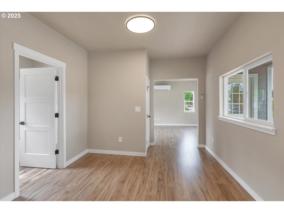 494 17th Street Northeast Salem, OR 97301 - Photo 29 of 44 a view of an empty room with wooden floor and window