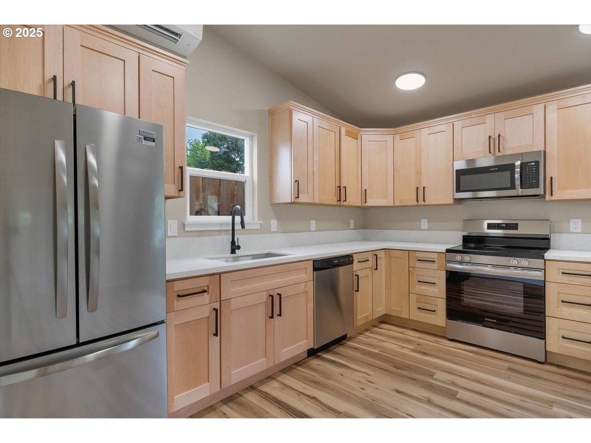 494 17th Street Northeast Salem, OR 97301 - Photo 36 of 44 a kitchen with stainless steel appliances granite countertop a refrigerator sink and microwave