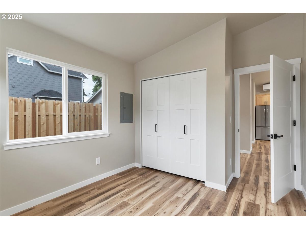 494 17th Street Northeast Salem, OR 97301 - Photo 43 of 44 a view of an empty room with wooden floor and a window
