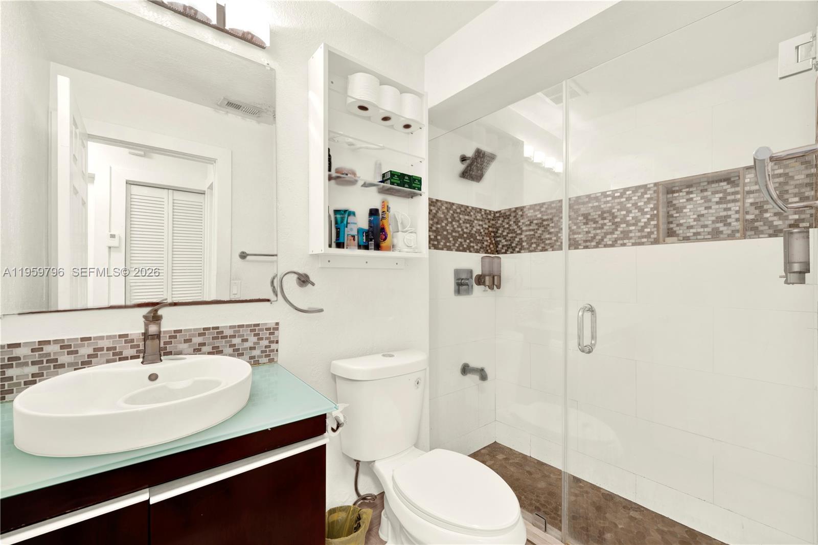 14600 Southwest 124th Place Miami, FL 33186 - Photo 17 of 34 a bathroom with a sink toilet and shower