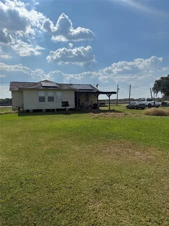 a view of a lake with a big yard