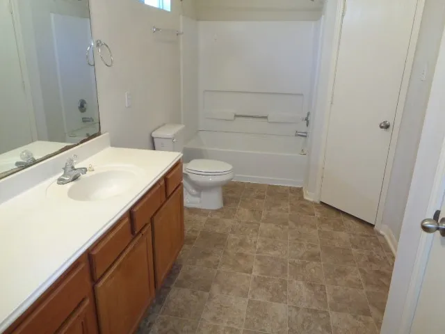 a view of an empty room and a window