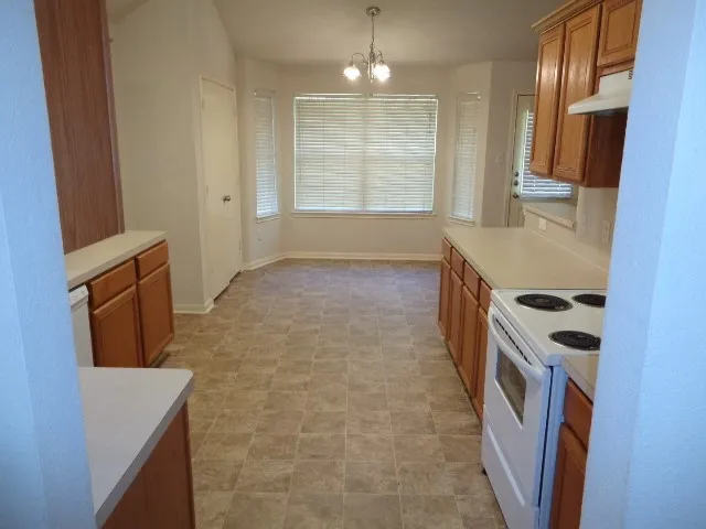 a view of a kitchen with a sink and dishwasher
