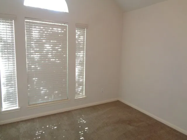 a white toilet sitting next to a bath tub