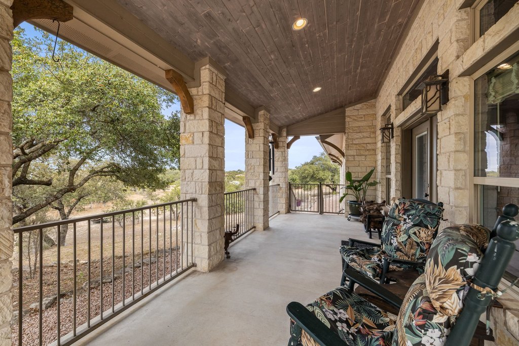 232 Crooked Oak Round Mountain, TX 78663 - Photo 6 of 40 a view of a porch with furniture and garden