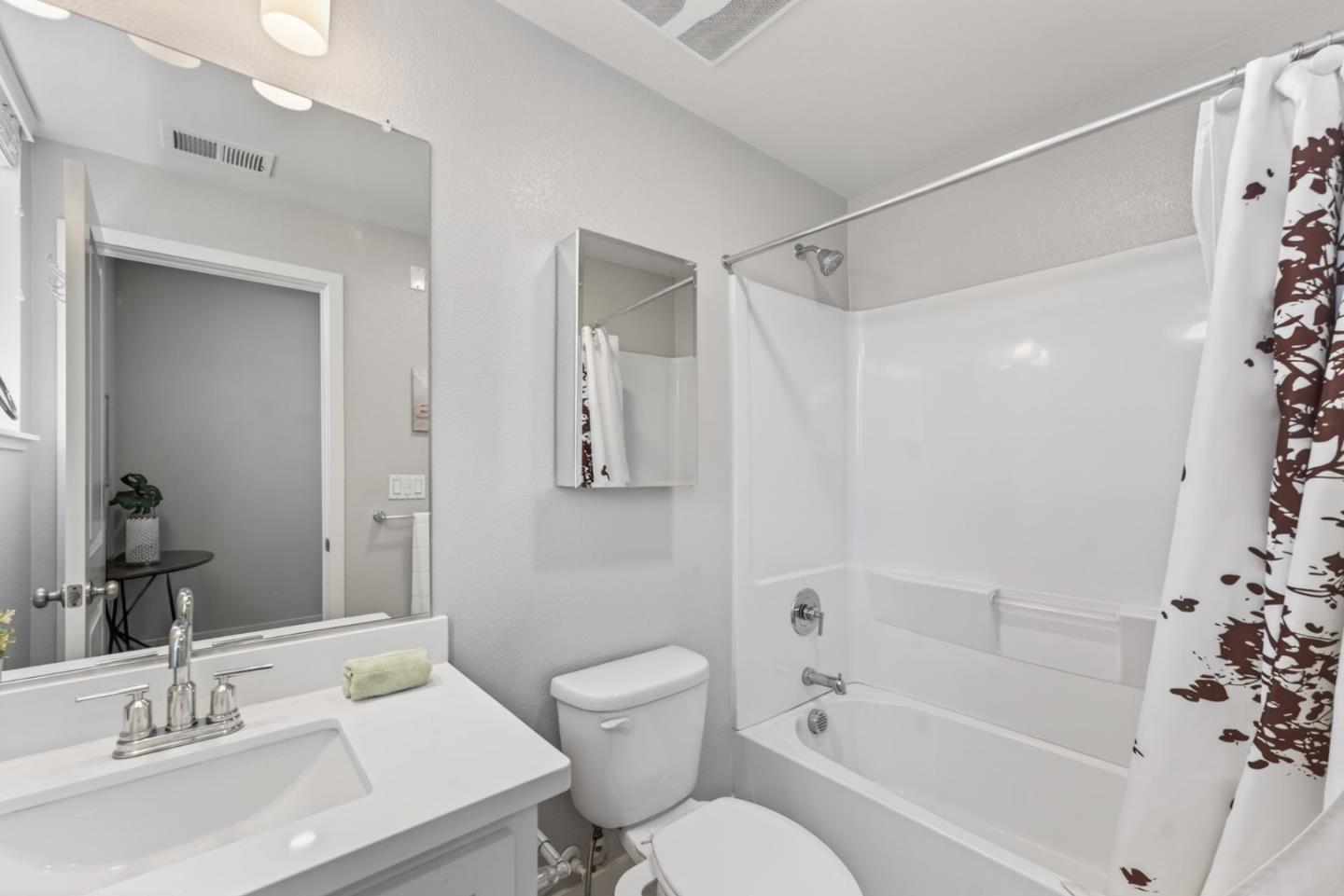 202 Market Street Milpitas, CA 95035 - Photo 21 of 30 a bathroom with a bathtub shower sink vanity and toilet
