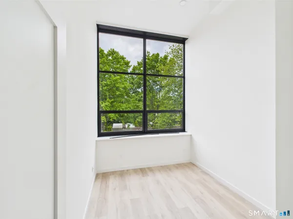 a view of a room that has a window in it