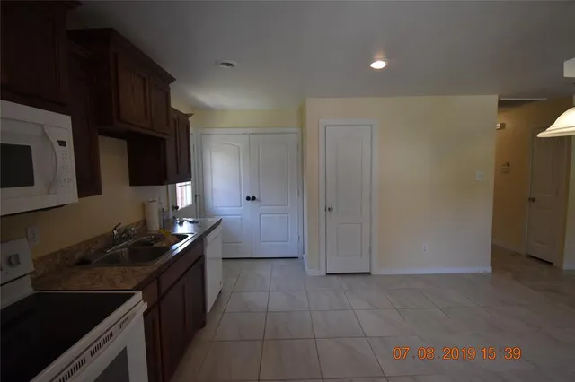 a kitchen with a sink and cabinets