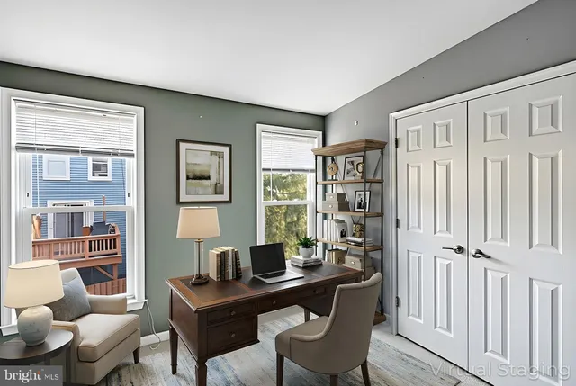a view of a livingroom with furniture and window