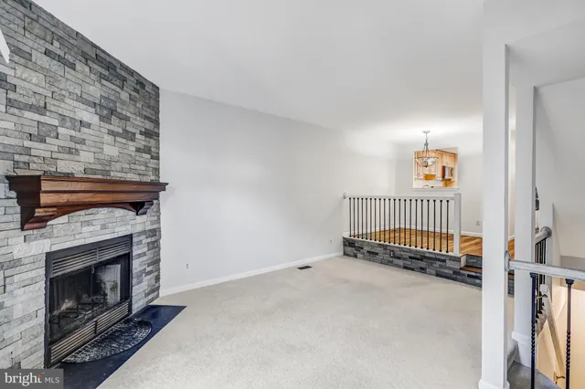 a view of livingroom with hardwood floor and a fireplace