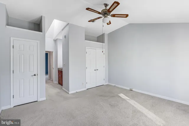 a bathroom with a granite countertop sink a mirror and a shower