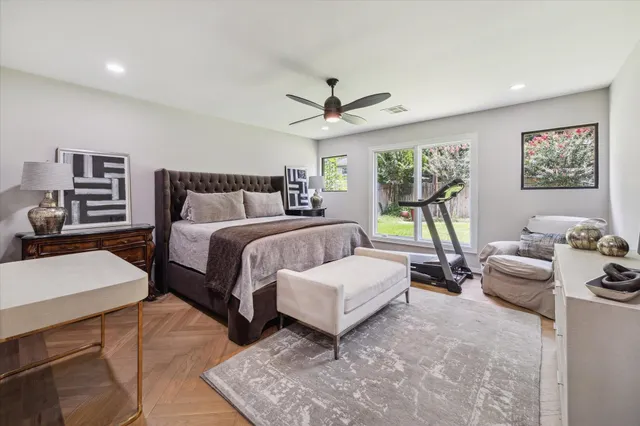 a bedroom with a bed and a couch