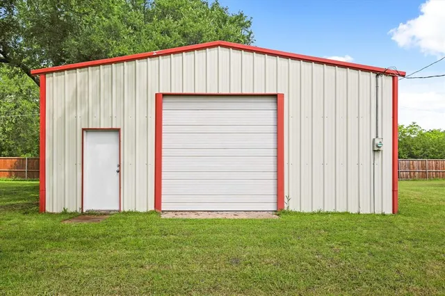 front view of a house with a garden