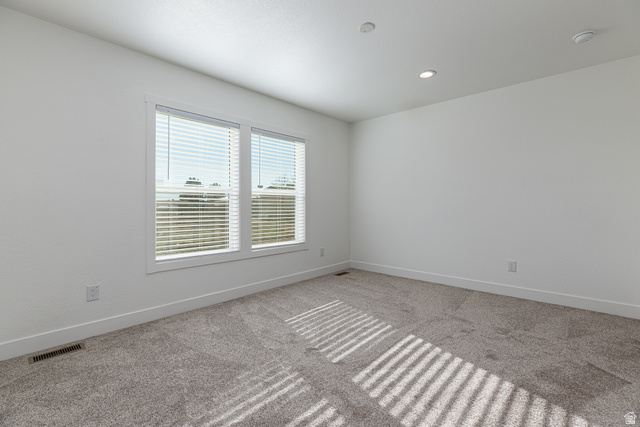 749 Riddle Drive Fredonia, AZ 86022 - Photo 21 of 41 Carpeted spare room featuring baseboards and recessed lighting