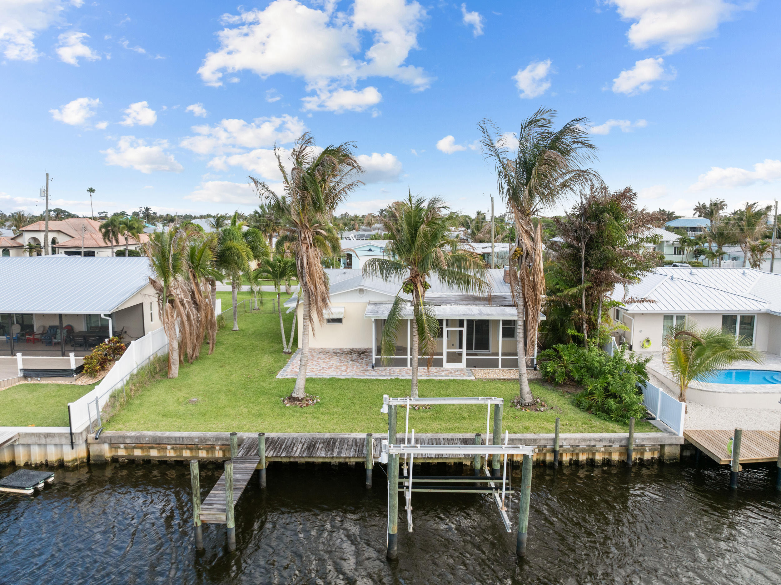 1459 Southwest Seahawk Way Palm City, FL 34990 - Photo 25 of 43 a swimming pool view with a outdoor seating