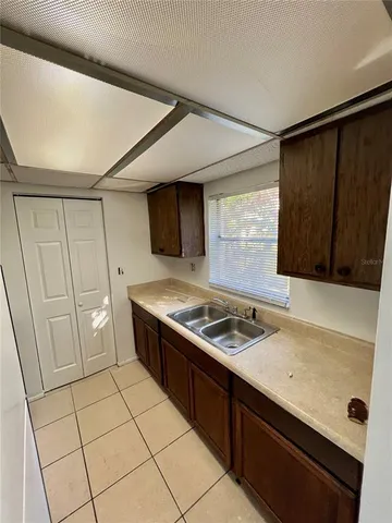 a kitchen with a stove and a refrigerator