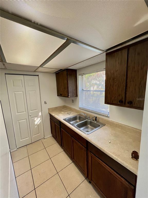 1916 Honour Road, Unit 1 Orlando, FL 32839 - Photo 14 of 20 a kitchen with a sink and a stove top oven