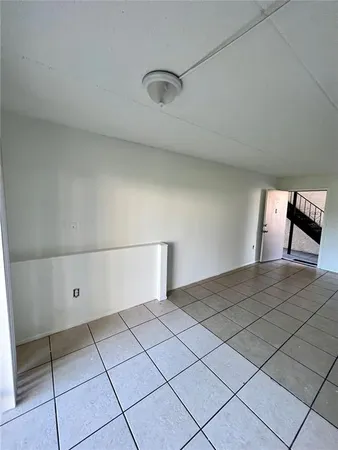a view of an empty room and window