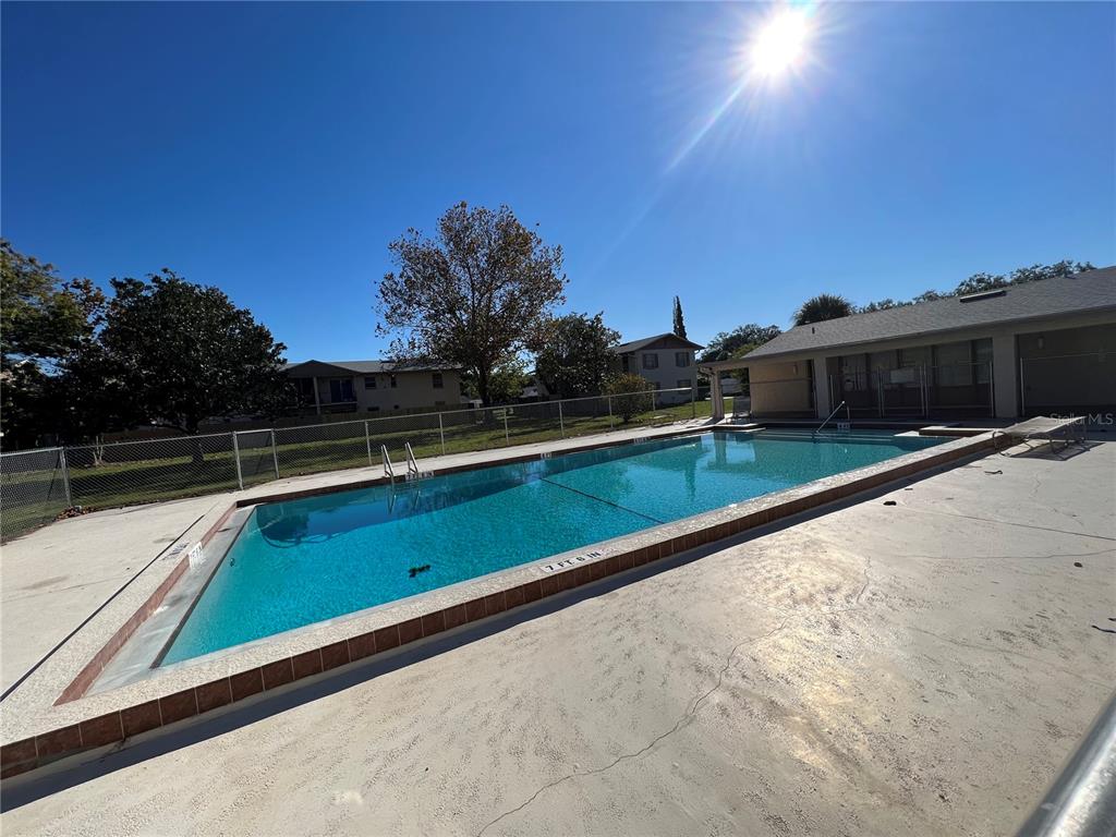 1916 Honour Road, Unit 1 Orlando, FL 32839 - Photo 19 of 20 a view of swimming pool with a yard