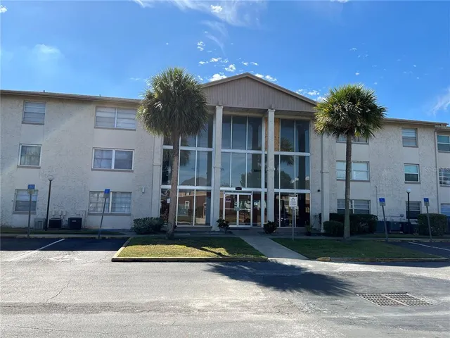 front view of a house with a swimming pool