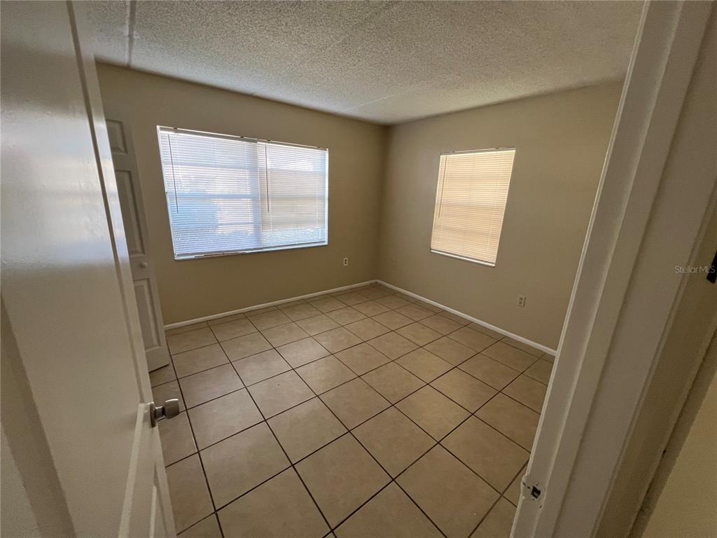 1916 Honour Road, Unit 1 Orlando, FL 32839 - Photo 9 of 20 a view of an empty room and window