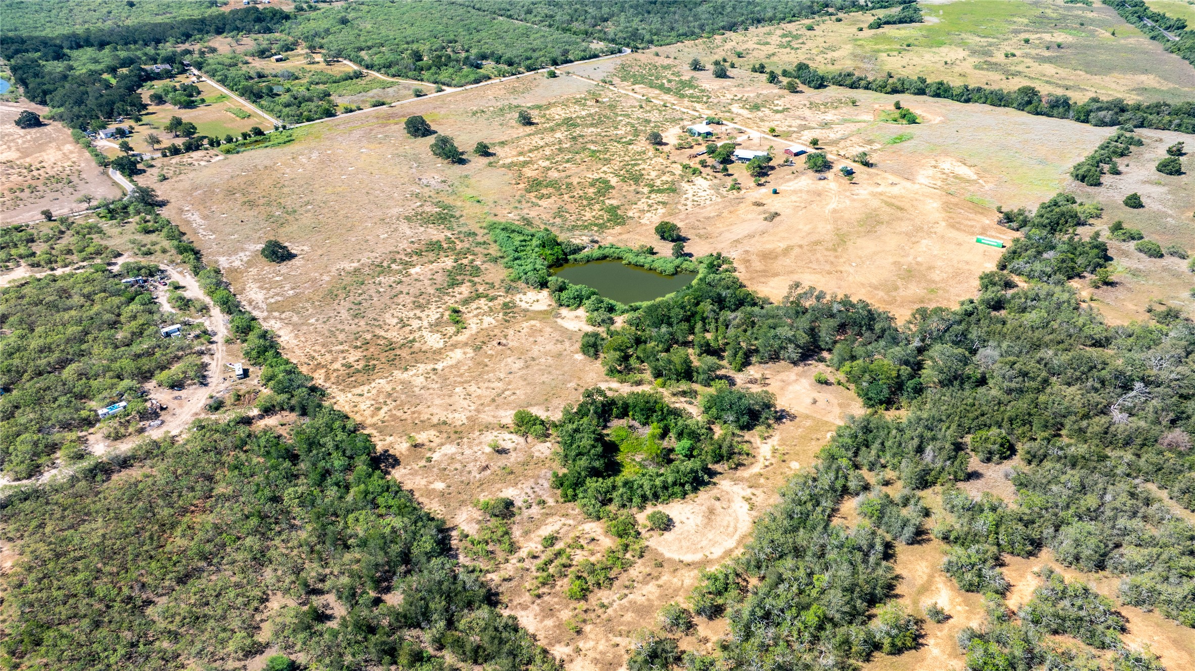 Lot 3 Tumbleweed Trail Dale, TX 78616 - Photo 3 of 20 Aerial overview of property's location with rural landscape and a nearby body of water