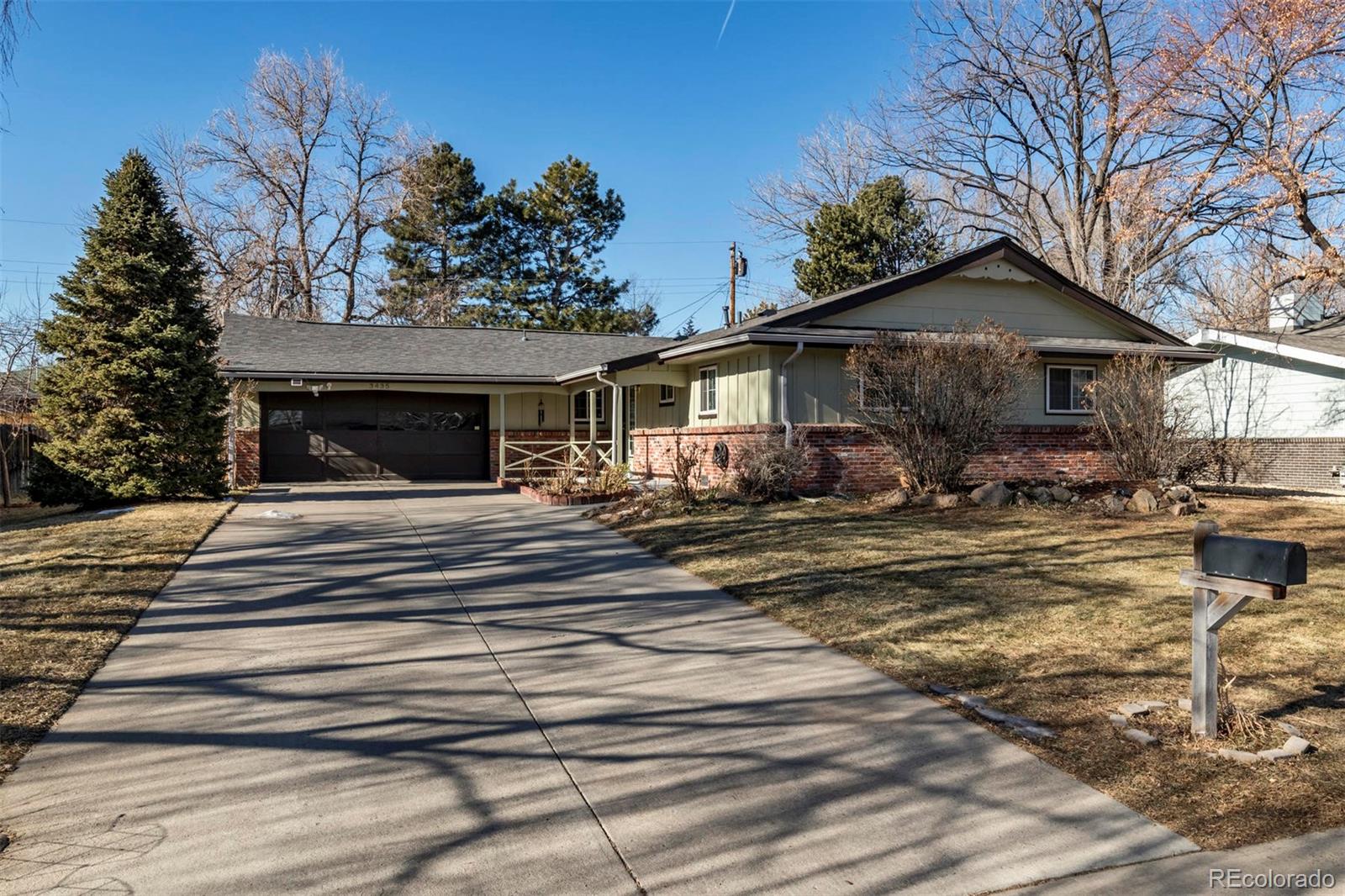3435 Ward Road Wheat Ridge, CO 80033 - Photo 1 of 32 a view of a house with a patio