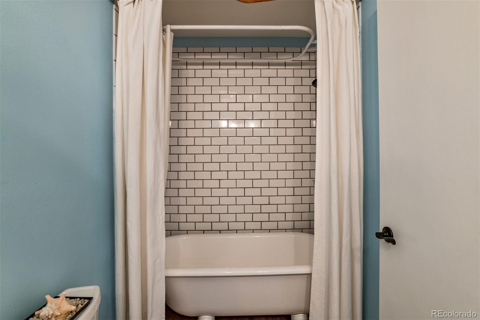 3435 Ward Road Wheat Ridge, CO 80033 - Photo 23 of 32 a bathroom with a shower