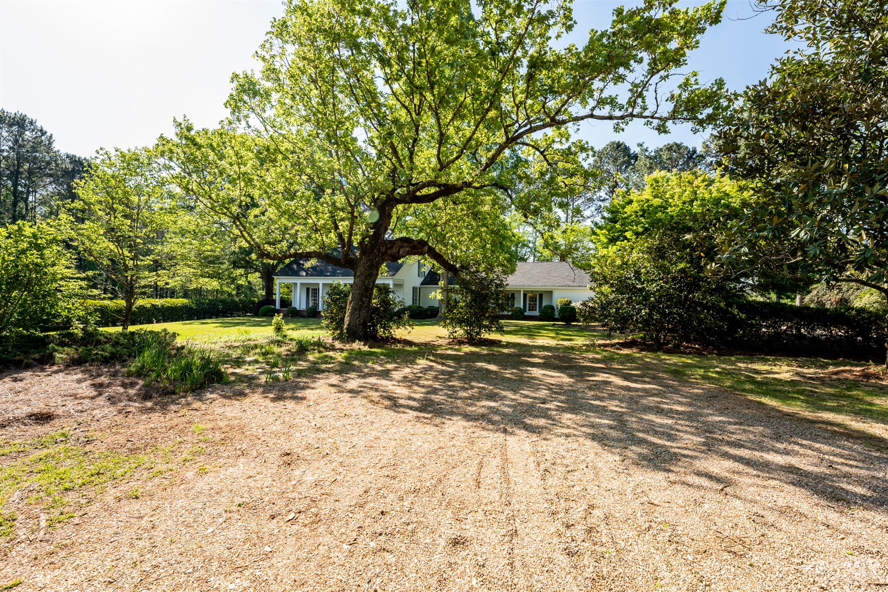 2569 Maynards Mill Road Forsyth, GA 31029 - Photo 2 of 67 a view of a yard with plants and trees
