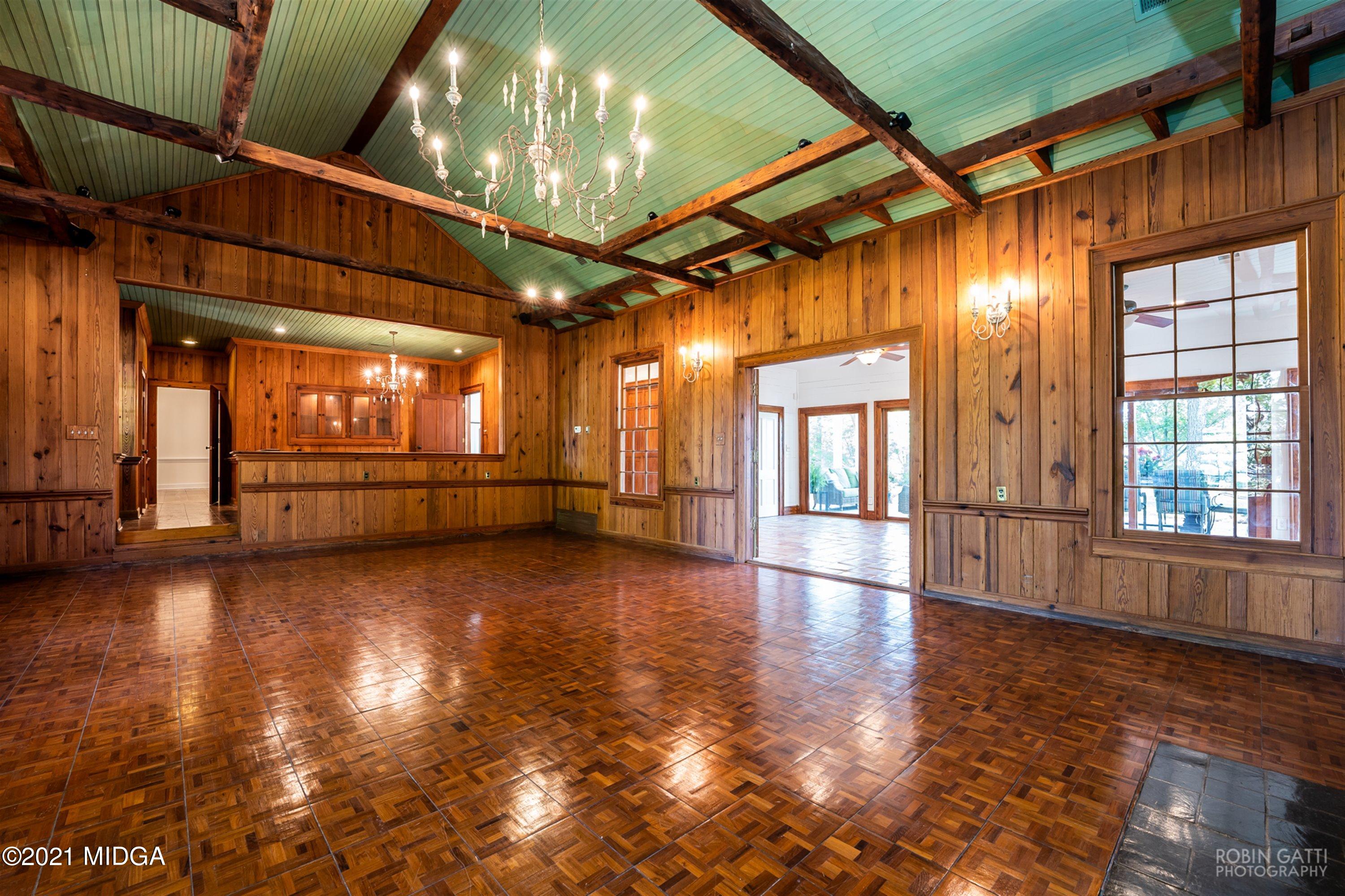 2569 Maynards Mill Road Forsyth, GA 31029 - Photo 23 of 67 a view of an empty room with wooden floor and a window