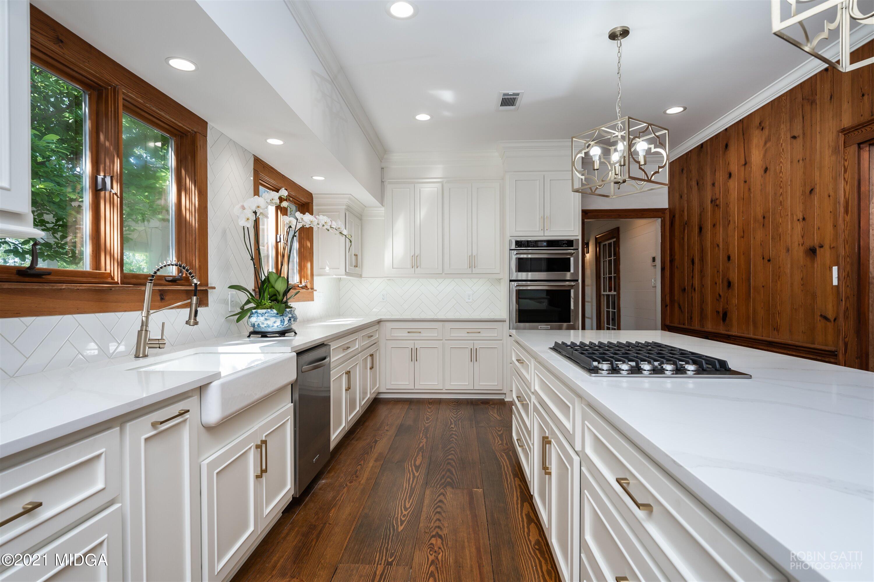 2569 Maynards Mill Road Forsyth, GA 31029 - Photo 28 of 67 a kitchen with stainless steel appliances a stove sink and cabinets