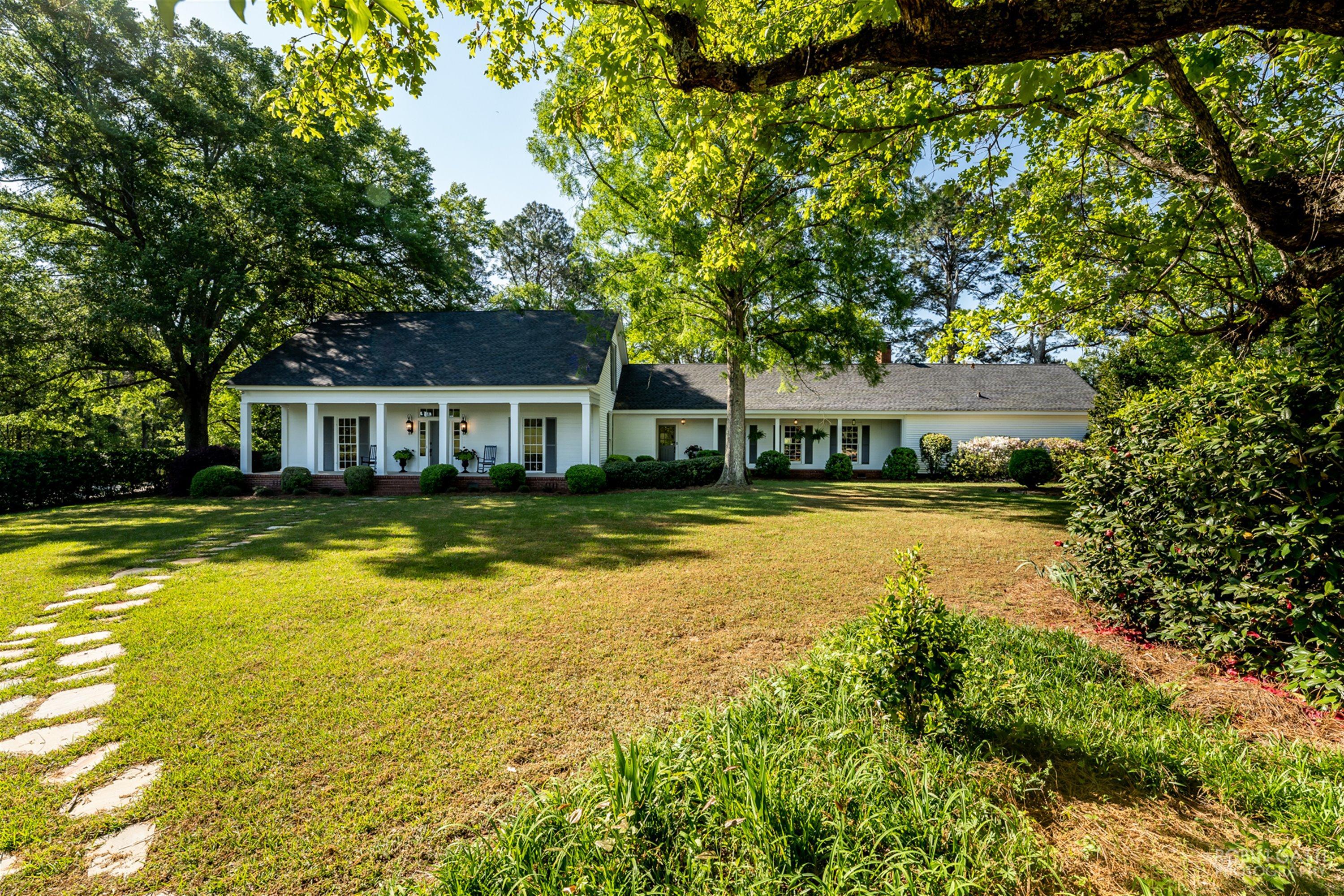 2569 Maynards Mill Road Forsyth, GA 31029 - Photo 4 of 67 a house with swimming pool in front of it