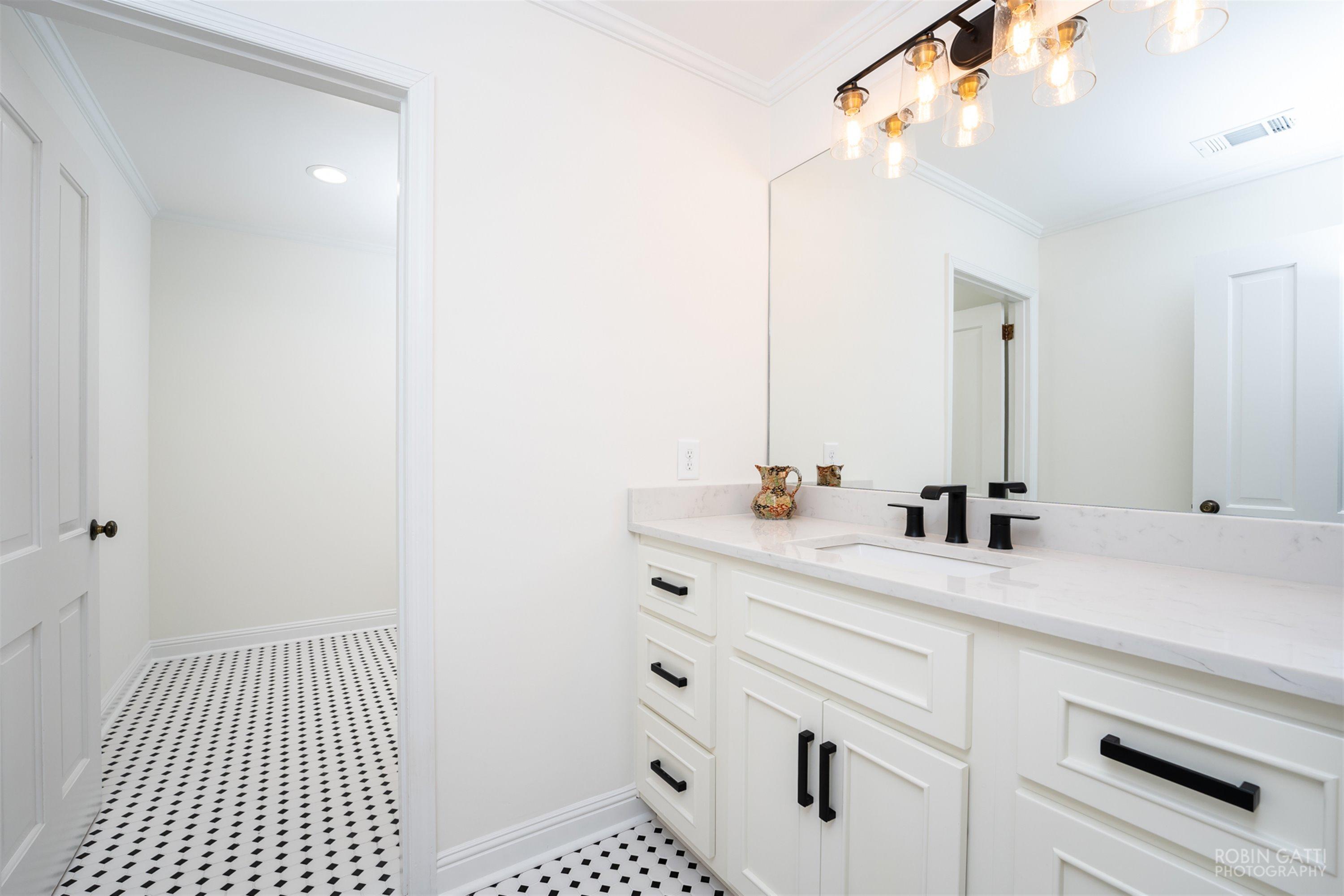 2569 Maynards Mill Road Forsyth, GA 31029 - Photo 32 of 67 a bathroom with a sink vanity granite and a mirror